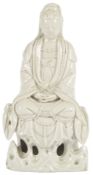 A Chinese blanc-de-chine figure of Guanyin, seated on a rockwork throne, height 24cm