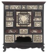 A Vietnamese hardwood and carved bone table cabinet, early 20th century, the front and sides inset