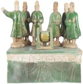 A Chinese Sancai glazed pottery funerary group, Ming dynasty, comprising six figures of servants,