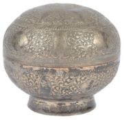 A Straits silvered metal offering box and cover, Indonesia, late 19th century, the cover decorated