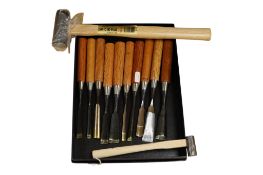 A set of ten Japanese wood working gouges, together with two Japanese mallets