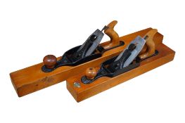 Two Stanley Bailey wood bottom transitional planes; a No.32 jointer plane and a No.28 fore plane