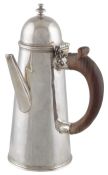 A Queen Anne silver chocolate pot with hinged cover, by Isaac Liger