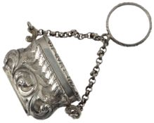 A William IV novelty silver vinaigrette, modelled as a handbag, the hinged cover decorated with a sc
