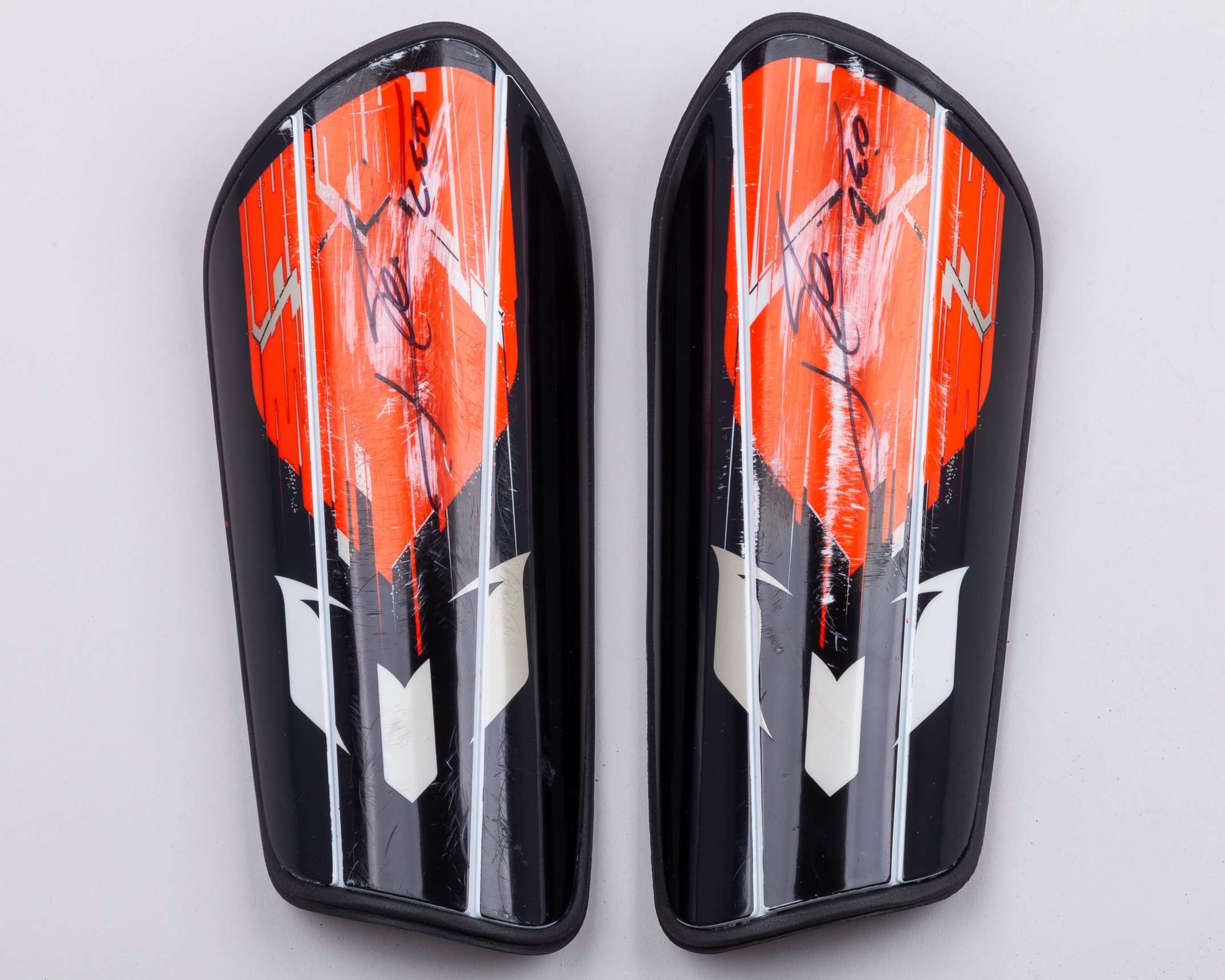 A pair of Lionel Messi autographed black and orange Adidas Messi Club shin pads - Image 3 of 4