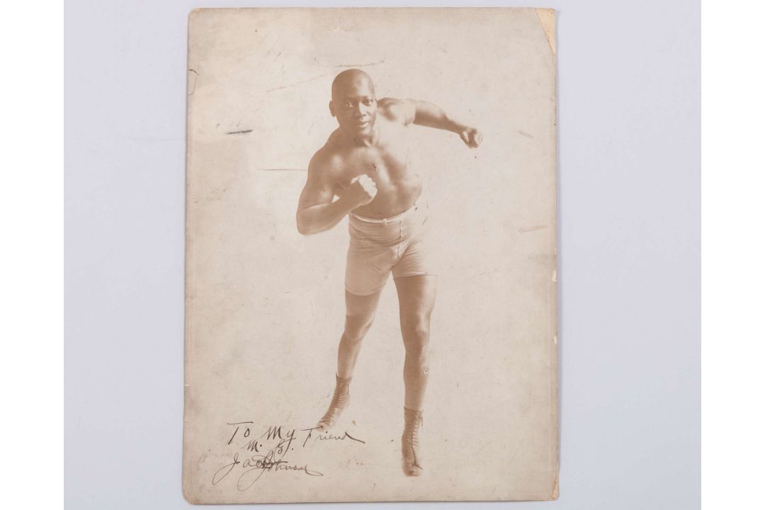 A sepia-toned photograph of boxer Jack Johnson - Image 1 of 7