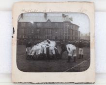 An early glass slide of a rugby scrum at Raeburn Park, Edinburgh