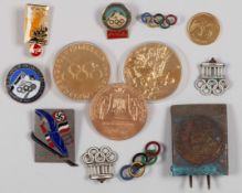 Two 1936 Berlin Olympic Games enamel lapel badges, formed as the Brandenburg Gate