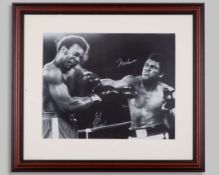 Muhammad Ali and George Foreman - an autographed black and white photograph