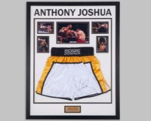 Anthony Joshua autographed white, black and gold boxing shorts display