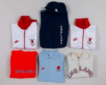 Two white and red England Athletics Team tracksuit tops