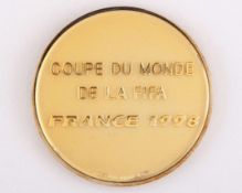 David Will: yellow-metal FIFA 1998 World Cup medal, designed by Bertoni
