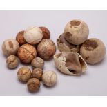 Four early lawn tennis balls and twelve leather jeu de paume tennis balls