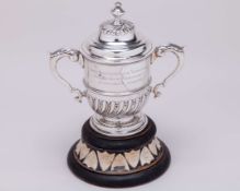 A silver Saxmundham Lawn Tennis Tournament trophy