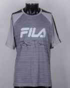 A grey Fila tennis shirt autographed by Bjorn Borg, UK XL, with crew-neck collar