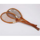 Two classic tennis rackets both with unusual handles