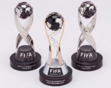 Six FIFA miniature trophies