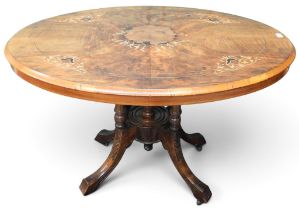 A Victorian burr walnut veneered oval tilt top breakfast table on quadrupedal base, 72cm high x