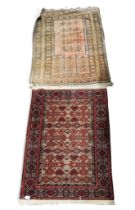 A lot comprising a beige ground Kuba Perepedil rug with multicoloured geometric patterned ground