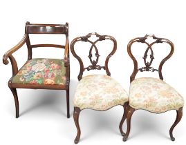 A lot comprising a 20th century mahogany regency style sabre legged dining carver, a pair of cane