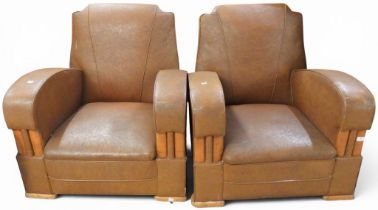 A pair of early 20th century brown Rexine upholstered Art Deco style club armchairs, 78cm high x