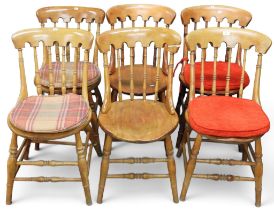 A set of six 19th century beech Windsor style dining chairs with turned spindle backs over round