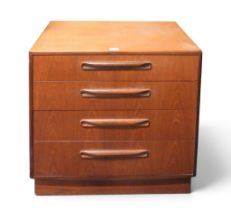 A mid 20th century teak G Plan "Fresco" four drawer chest with moulded handles on plinth base,