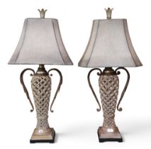 A pair of contemporary "Uttermost" resin table lamps with canted shades over pierced urn bases, 85cm