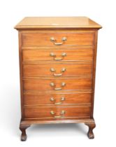 A late 19th century mahogany narrow chest of drawers with six drawers with brass drawer pulls on