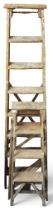 A lot comprising an early 20th century beech and elm set of decorators ladders, 206cm high and a