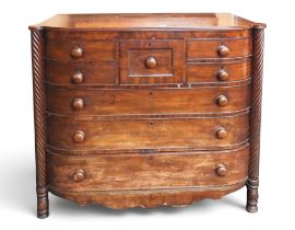 A large Victorian mahogany veneered Scotch style chest with deep central drawer flanked by pairs