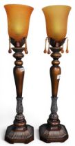 A pair of contemporary copper toned table lamps with crackle glaze shades on acanthus decorated
