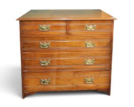 An early 20th century oak two over three chest of drawers with embossed brass drawer pulls, 100cm