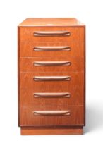 A mid 20th century teak G Plan "Fresco" narrow six drawer chest with moulded handle on plinth