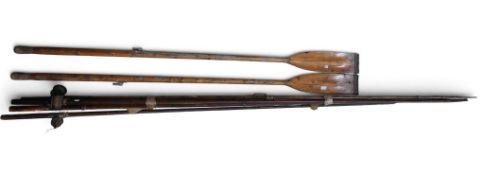A pair of varnished pine oars, approx. 213cm in length; together with three large-scale solid-wood