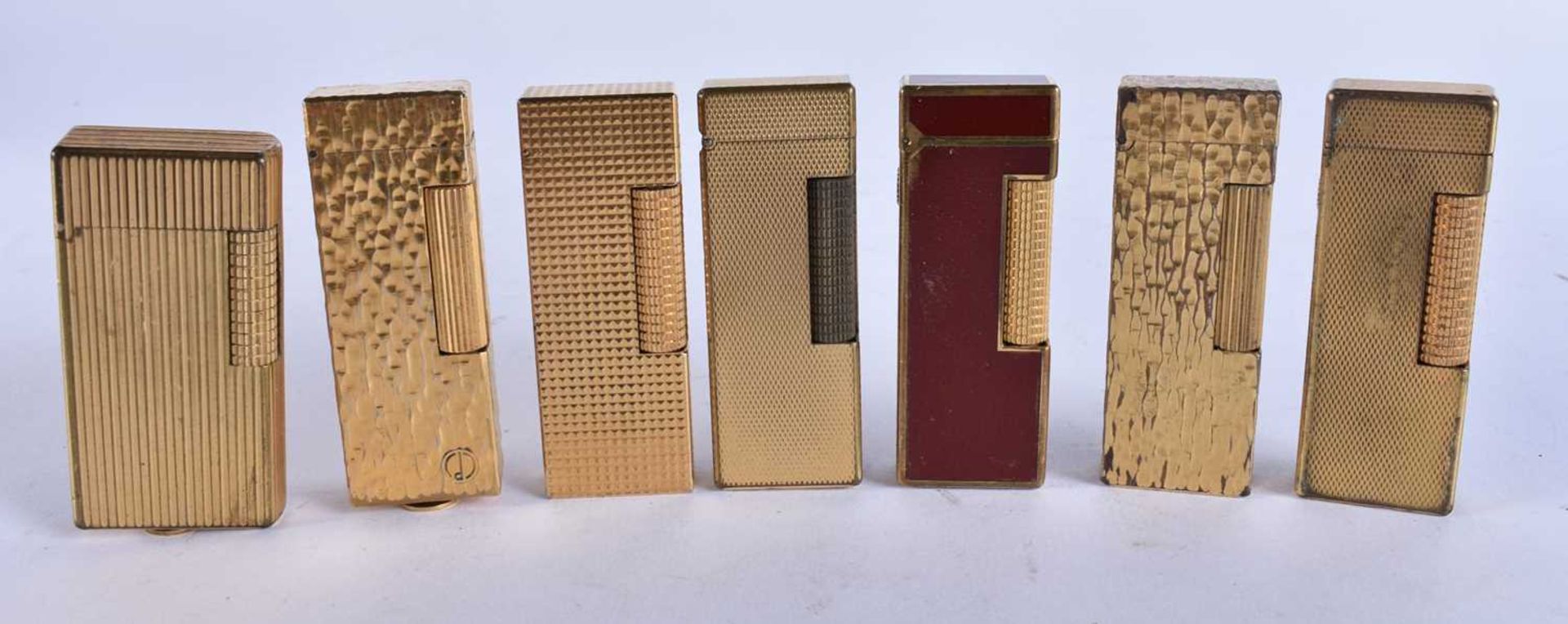 SEVEN DUNHILL LIGHTERS. (7)