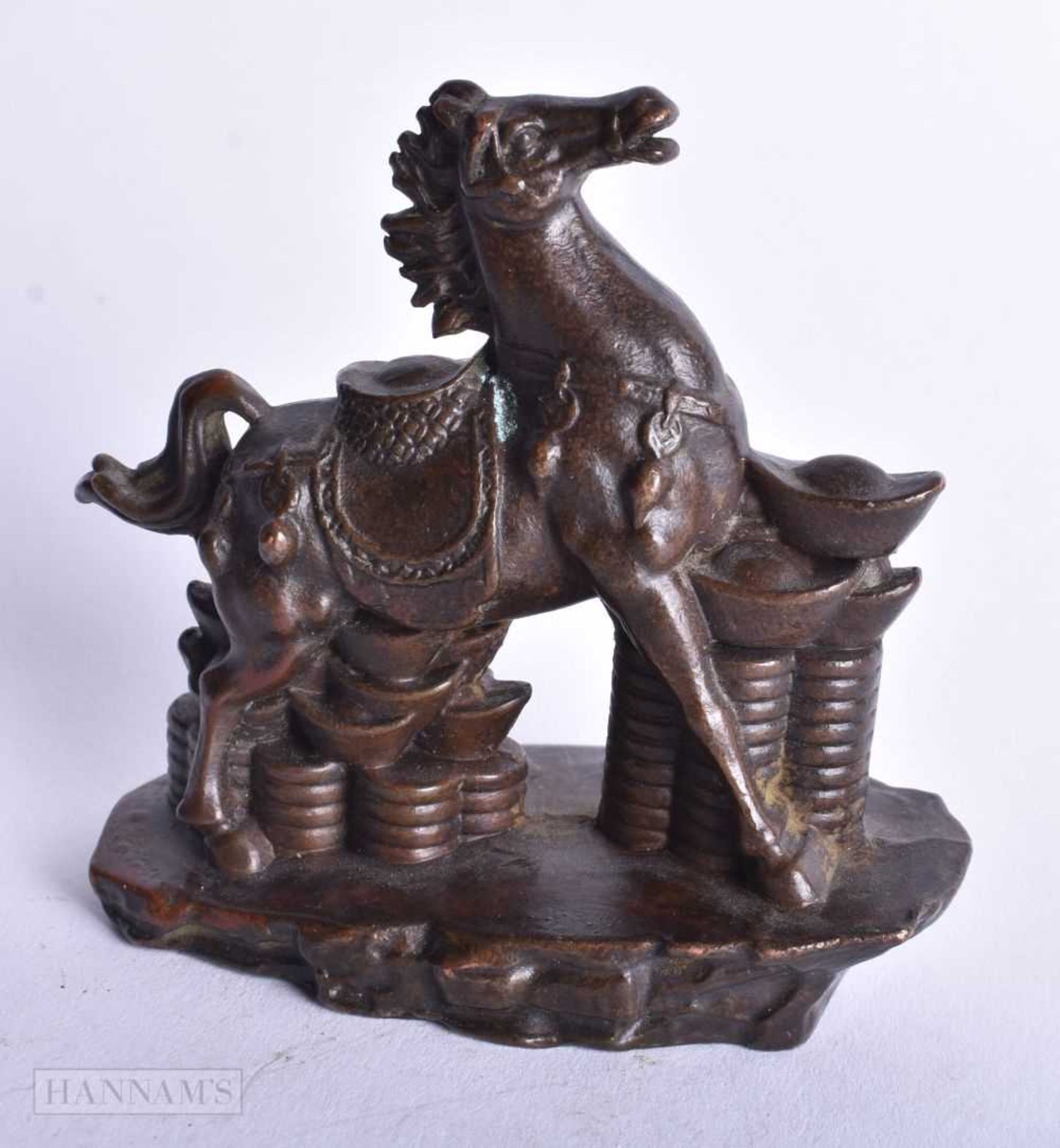 A Chinese Bronze Horse Standing on Ingots. 7.6cm x 7.9cm x 4.1cm