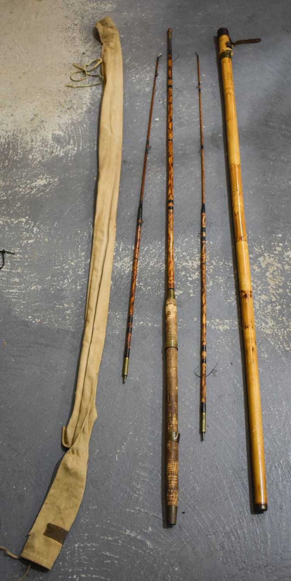 A VERY LARGE BAMBOO FISHING POLE and Hardys rod. (2)