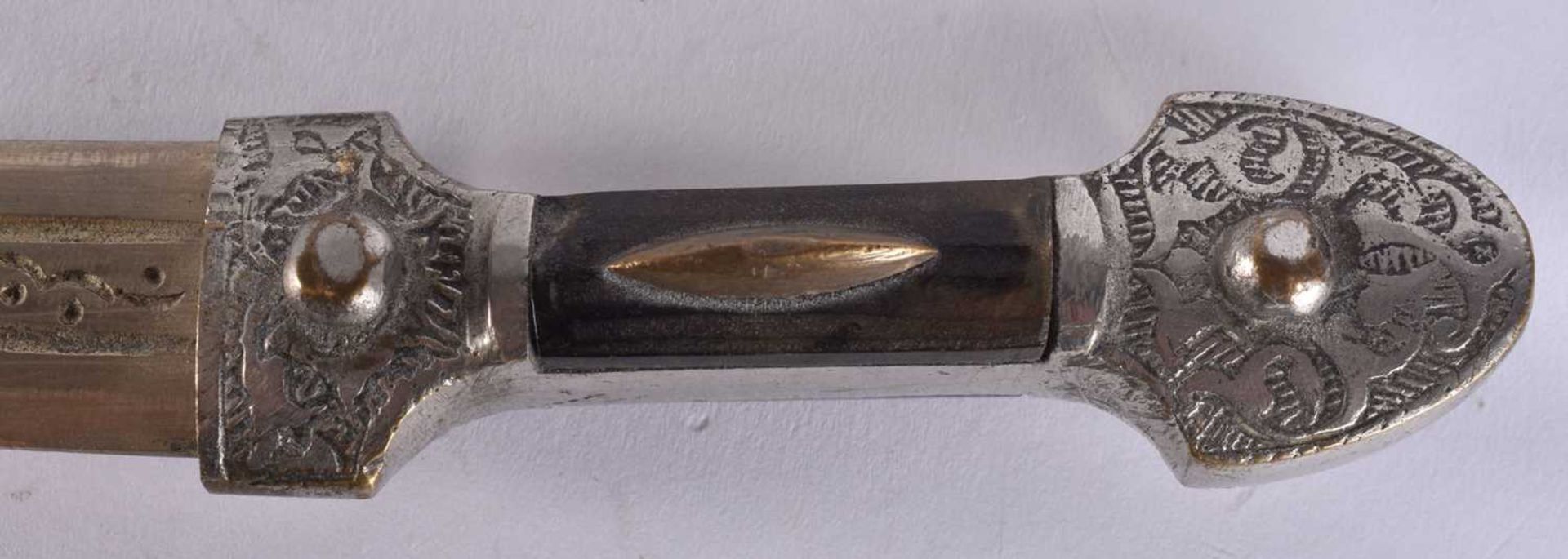 A MIDDLE EASTERN WHITE METAL OVERLAID DAGGER. 20.5 cm long. We are unable to offer in-house shipping - Image 2 of 4