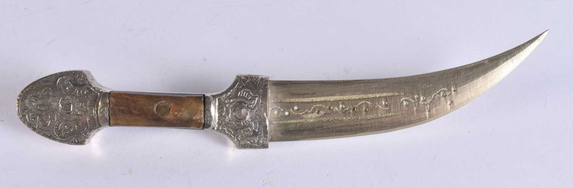 A MIDDLE EASTERN WHITE METAL OVERLAID DAGGER. 20.5 cm long. We are unable to offer in-house shipping - Image 4 of 4
