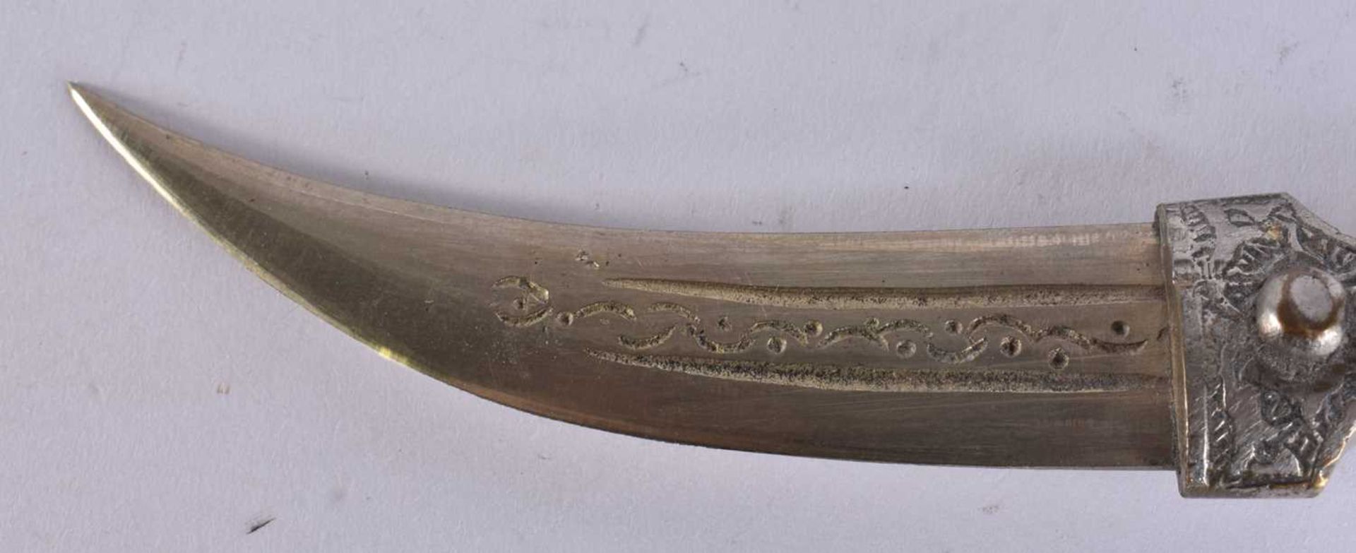 A MIDDLE EASTERN WHITE METAL OVERLAID DAGGER. 20.5 cm long. We are unable to offer in-house shipping - Image 3 of 4
