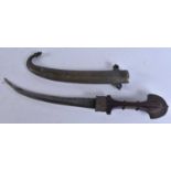 A LARGER MIDDLE EASTERN BRASS OVERLAID DAGGER. 40 cm long. We are unable to offer in-house