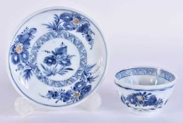 AN UNUSUAL 18TH CENTURY ENGLISH ENAMELLED GLASS TEABOWL AND SAUCER painted with flowers. 10.5 cm