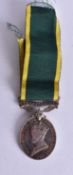 A TERRITORIAL MEDAL presented to 2072175 SPR F A Etherington RE.