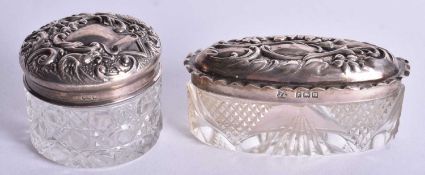 Two Glass Cosmetic Jars with Embossed Silver Lids. Birmingham Hallmarks. Largest 4cm x 4.6 cm, total