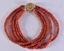 A 18CT CLASP STRING CORAL BEAD NECKLACE. 150 grams. 39 cm.