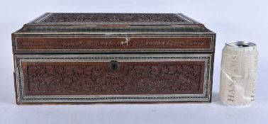 A LARGE 19TH CENTURY ANGLO INDIAN CARVED SANDALWOOD CASKET finely carved with landscapes,