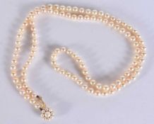 A 9CT GOLD AND PEARL NECKLACE. 23.8 grams. 65 cm long.