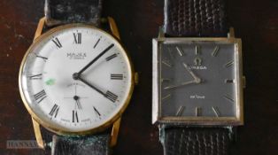 AN OMEGA WRISTWATCH and another. Running. Largest 3.25cm wide. (2)