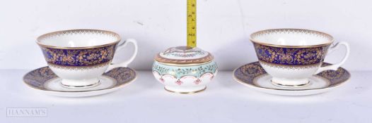 A pair of Royal collection Commemorative Kings China Tea cups and saucers together with a small